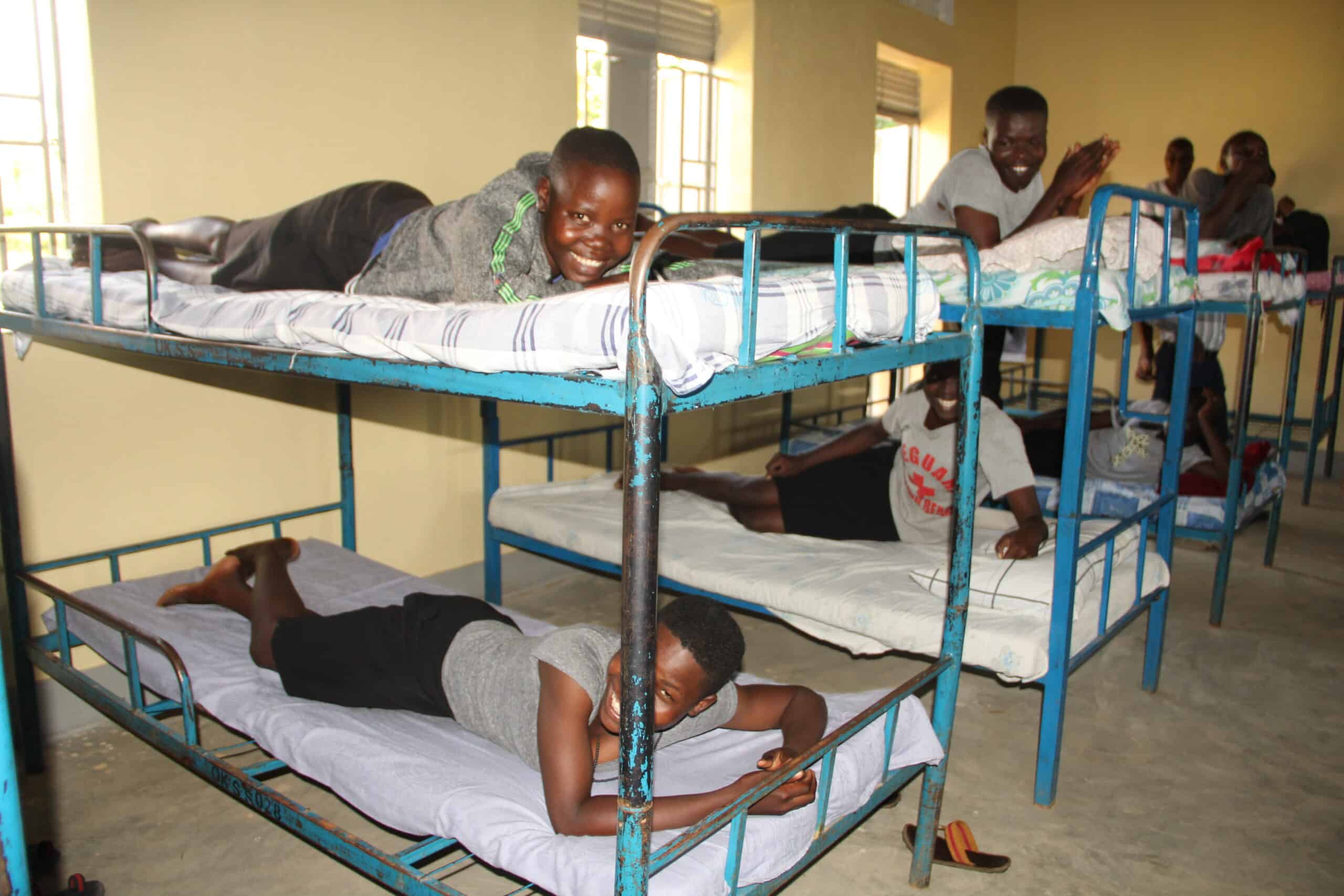 ORA-Uganda_Girls-Hostel_Girls-enjoying-new-Dormitory_Photo-referred-to...-1
